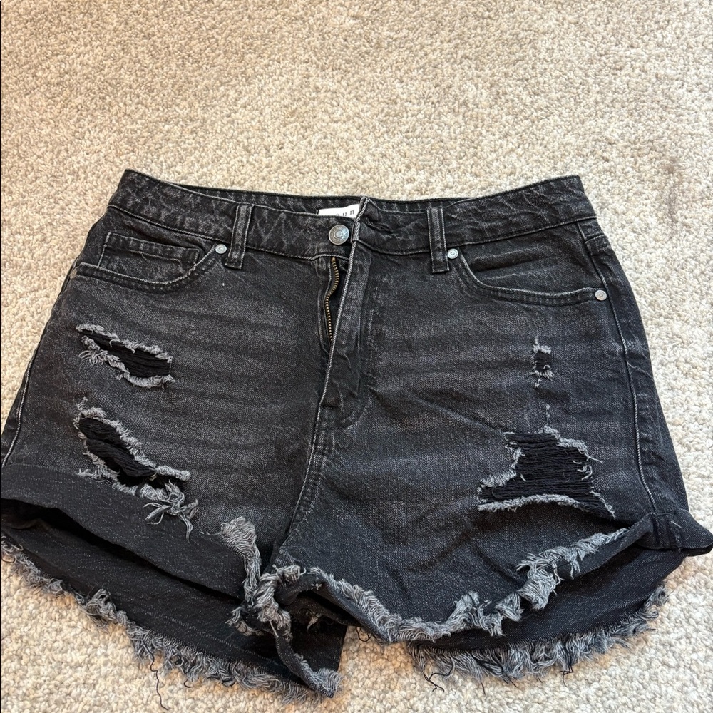 Black eunina distressed jean shorts.